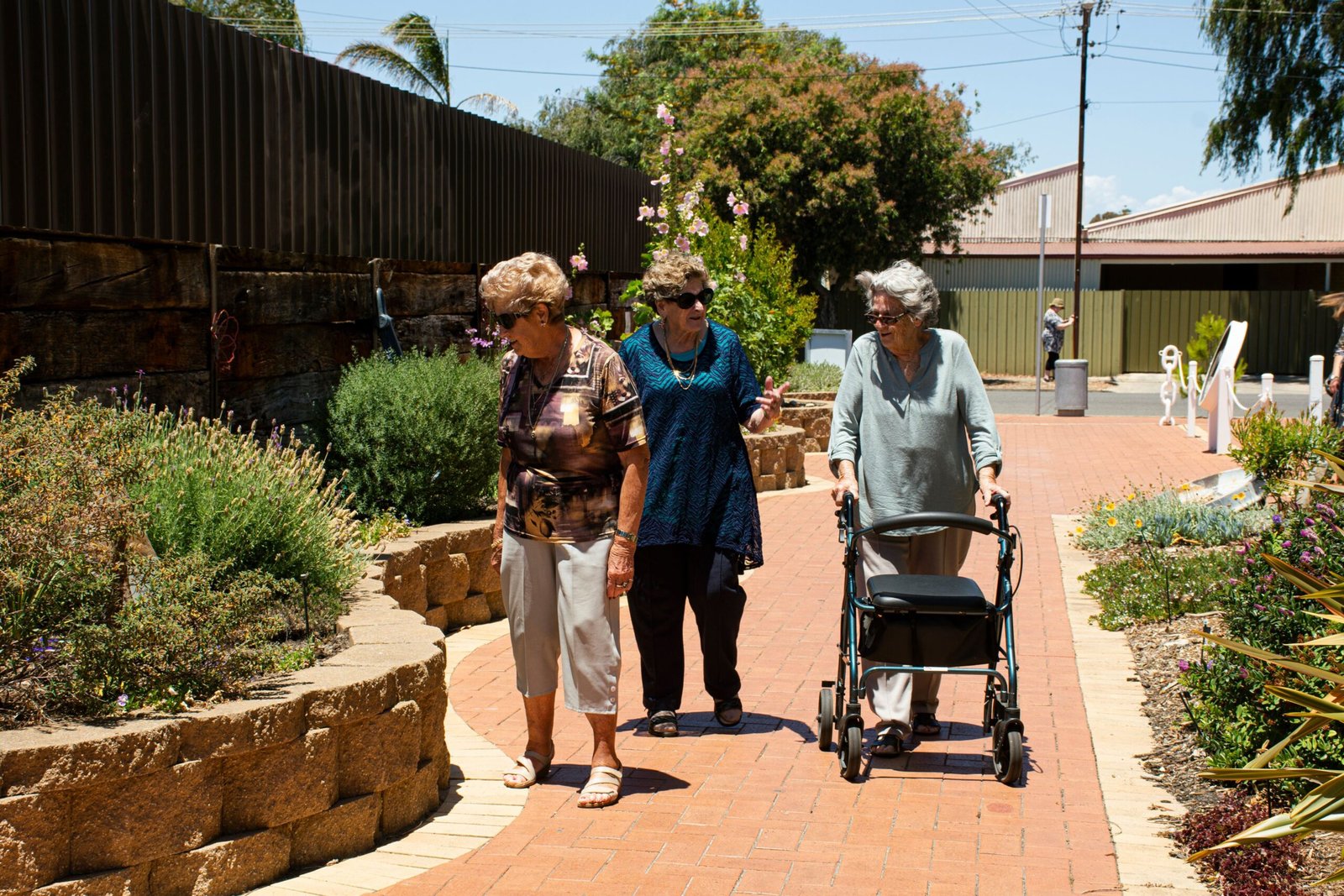 Senior women walking together after community access transport in Frankston